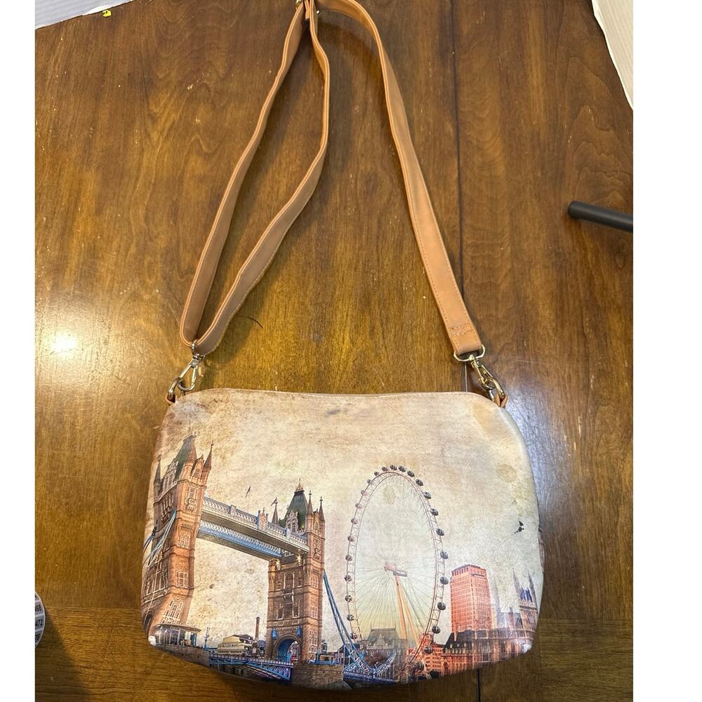 London City print shoulder bag with a beige strap.